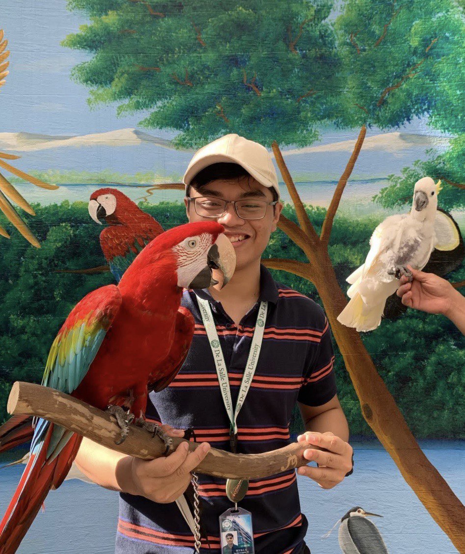 Joaquin with parrots